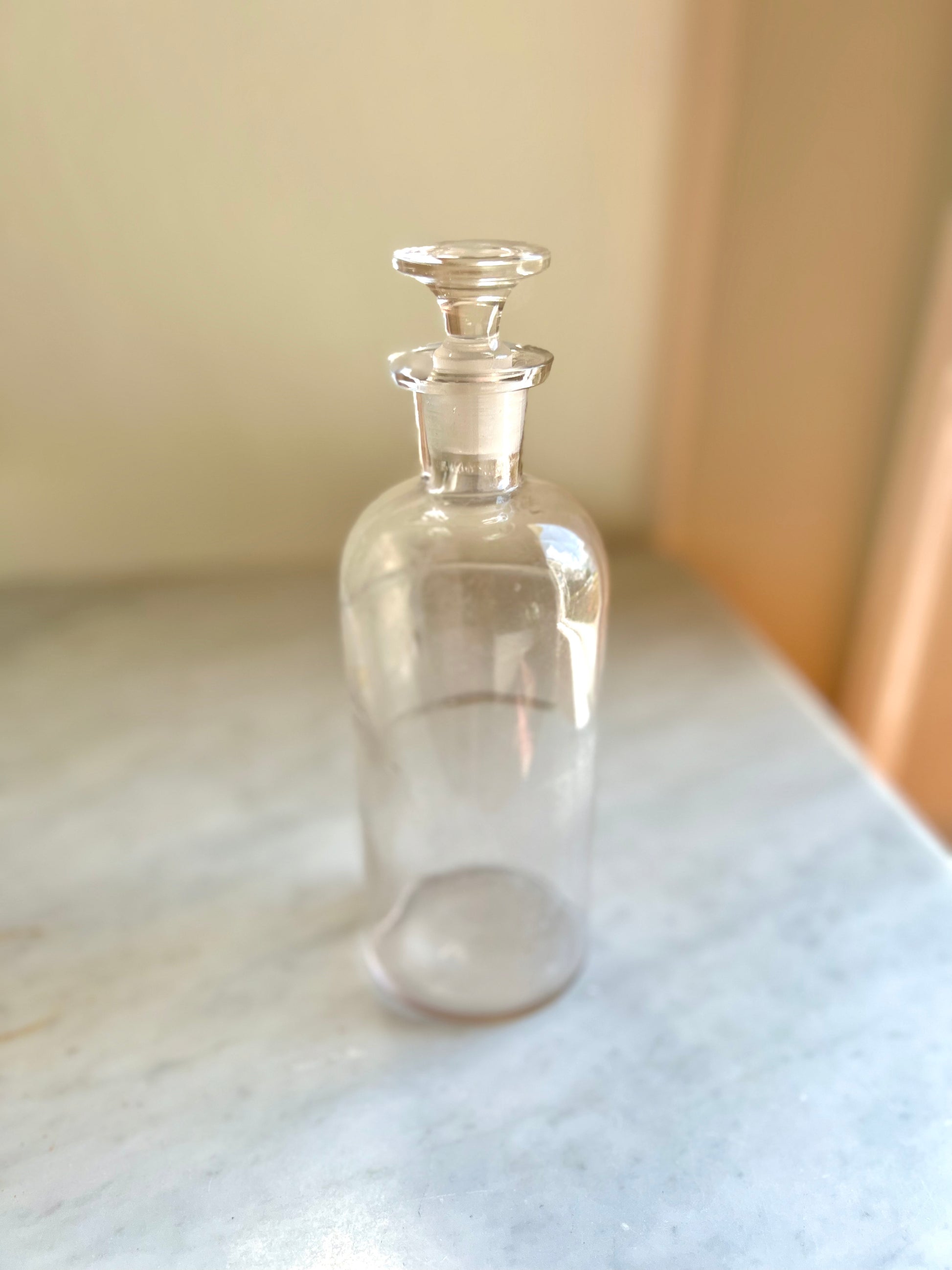 antique apothecary jar with stopper