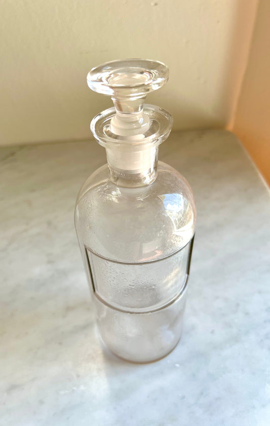antique apothecary jar with stopper