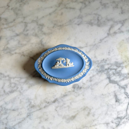 Blue decorative dish with intricate design on a marble surface