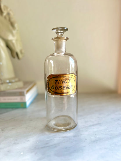 antique apothecary jar with stopper