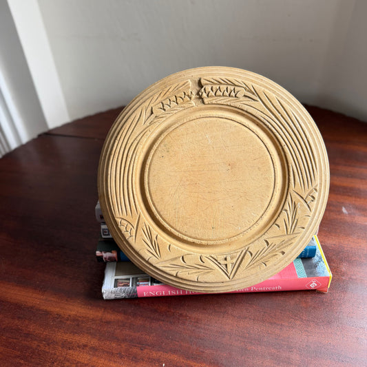 Vintage English wooden bread board with carved wheat design