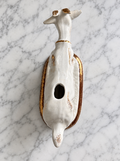 Top view of vintage ceramic cow creamer showing back opening and gold accents, edited image