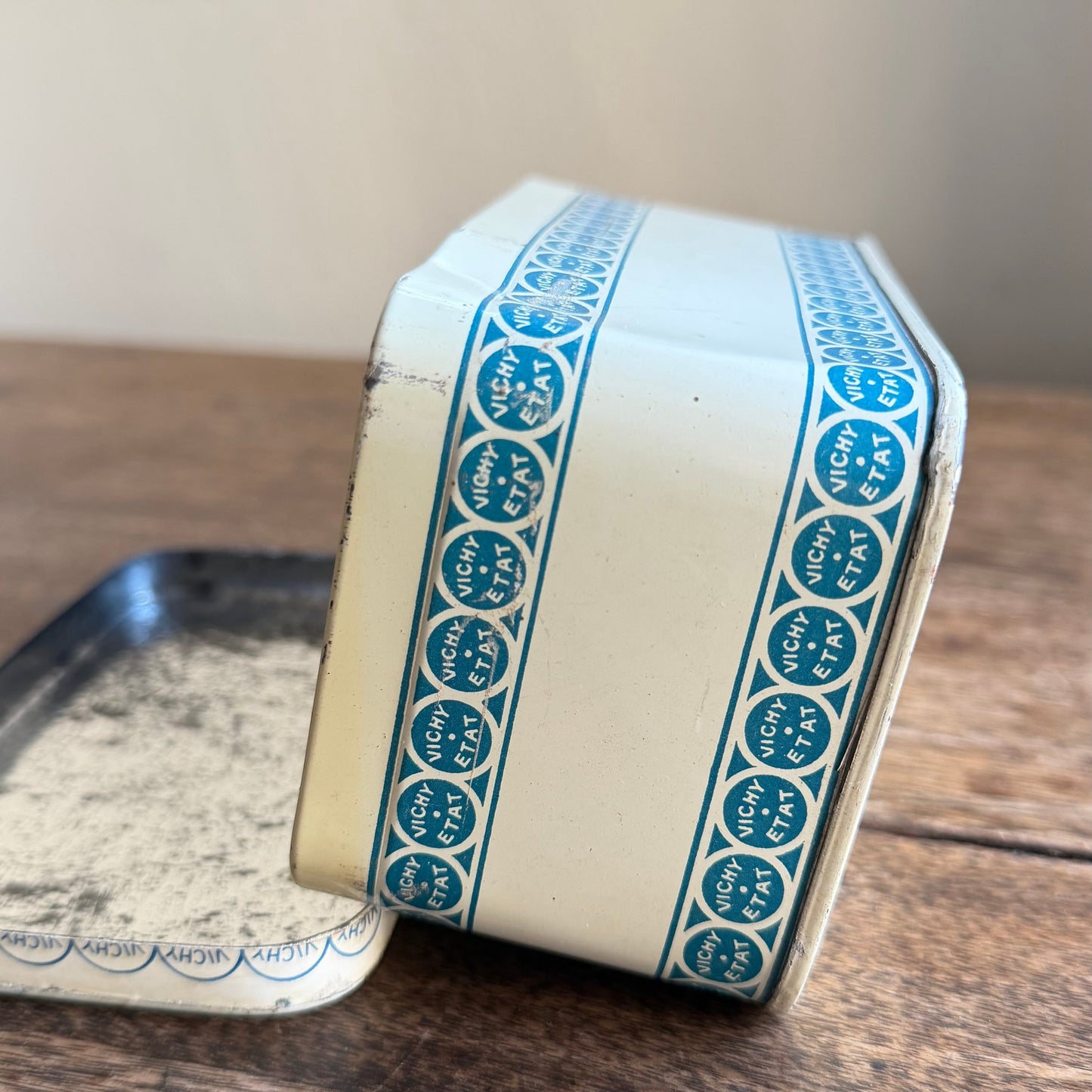 Small rectangular box with blue pattern on a wooden surface