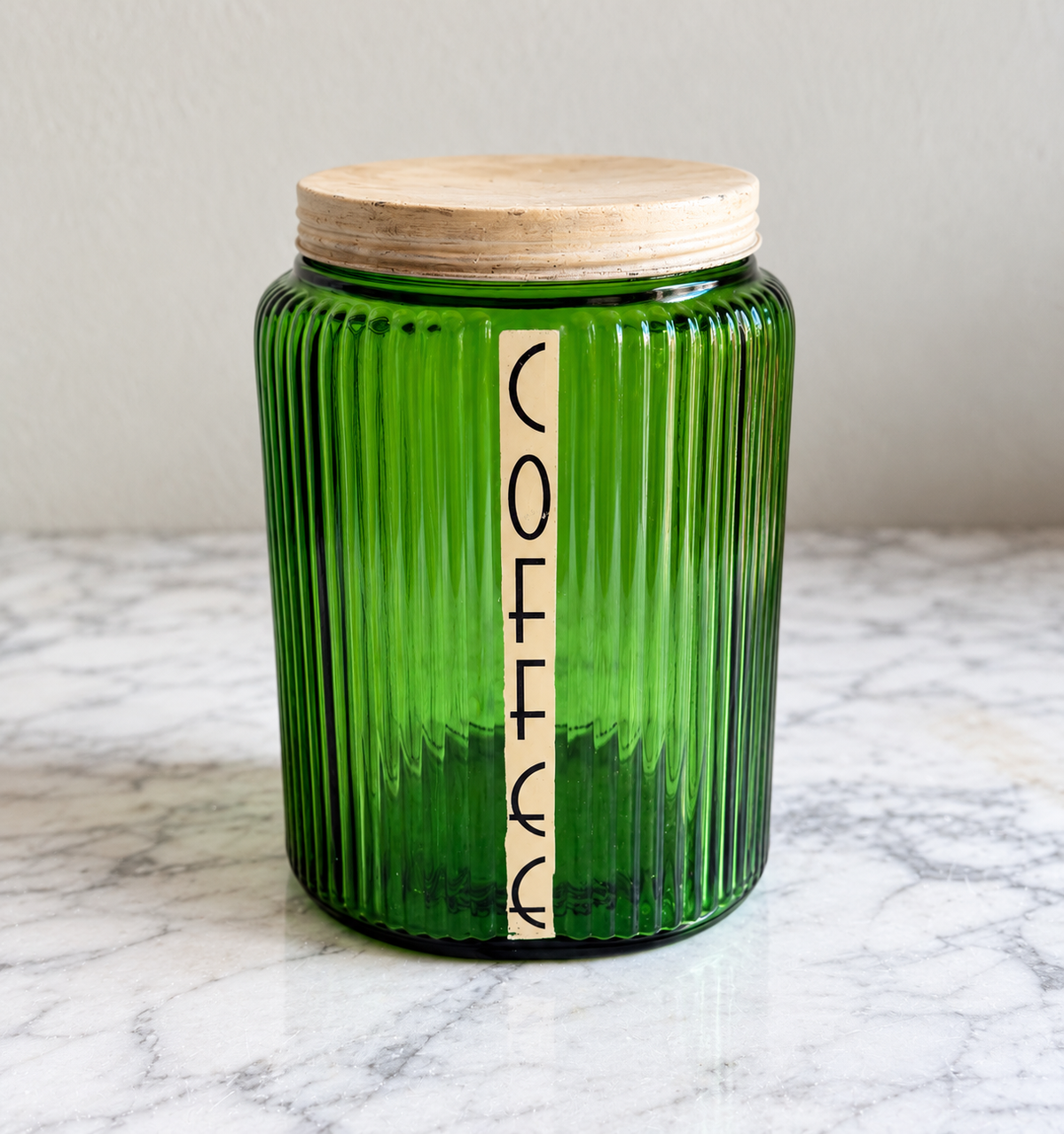 Vintage forest green ribbed glass coffee canister with vertical COFFEE label and pale lid
