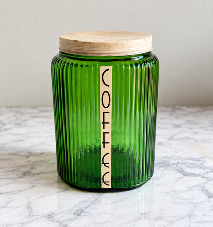 Vintage forest green ribbed glass coffee canister with vertical COFFEE label and pale lid