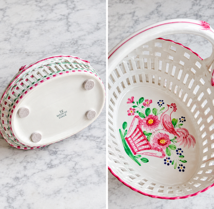 Interior of vintage reticulated ceramic basket with hand-painted bird and floral motif